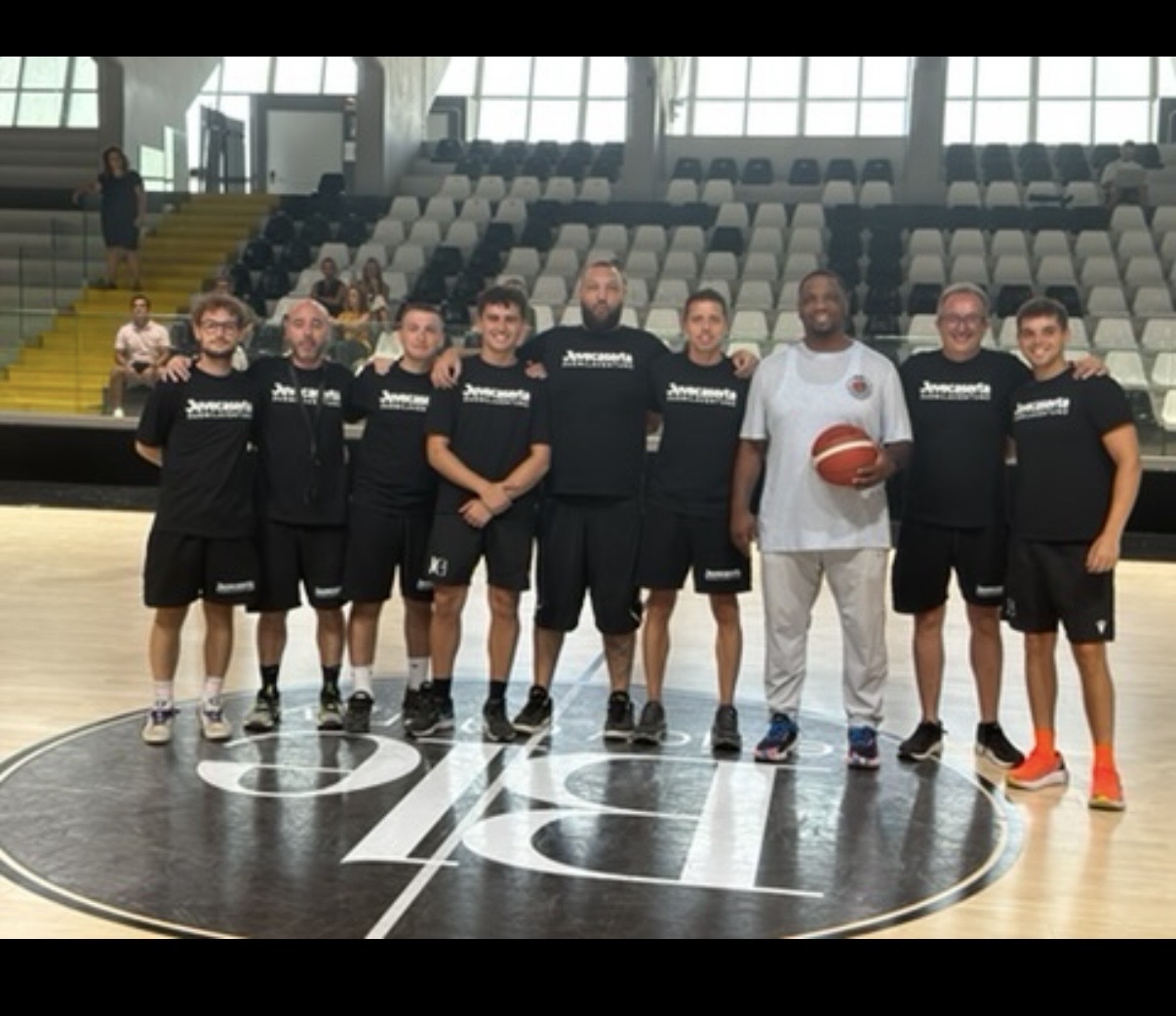 Group photo of IBB staff and players at Juve Caserta